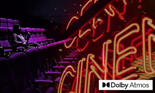 Neon signs on a screen featuring Dolby Atmos